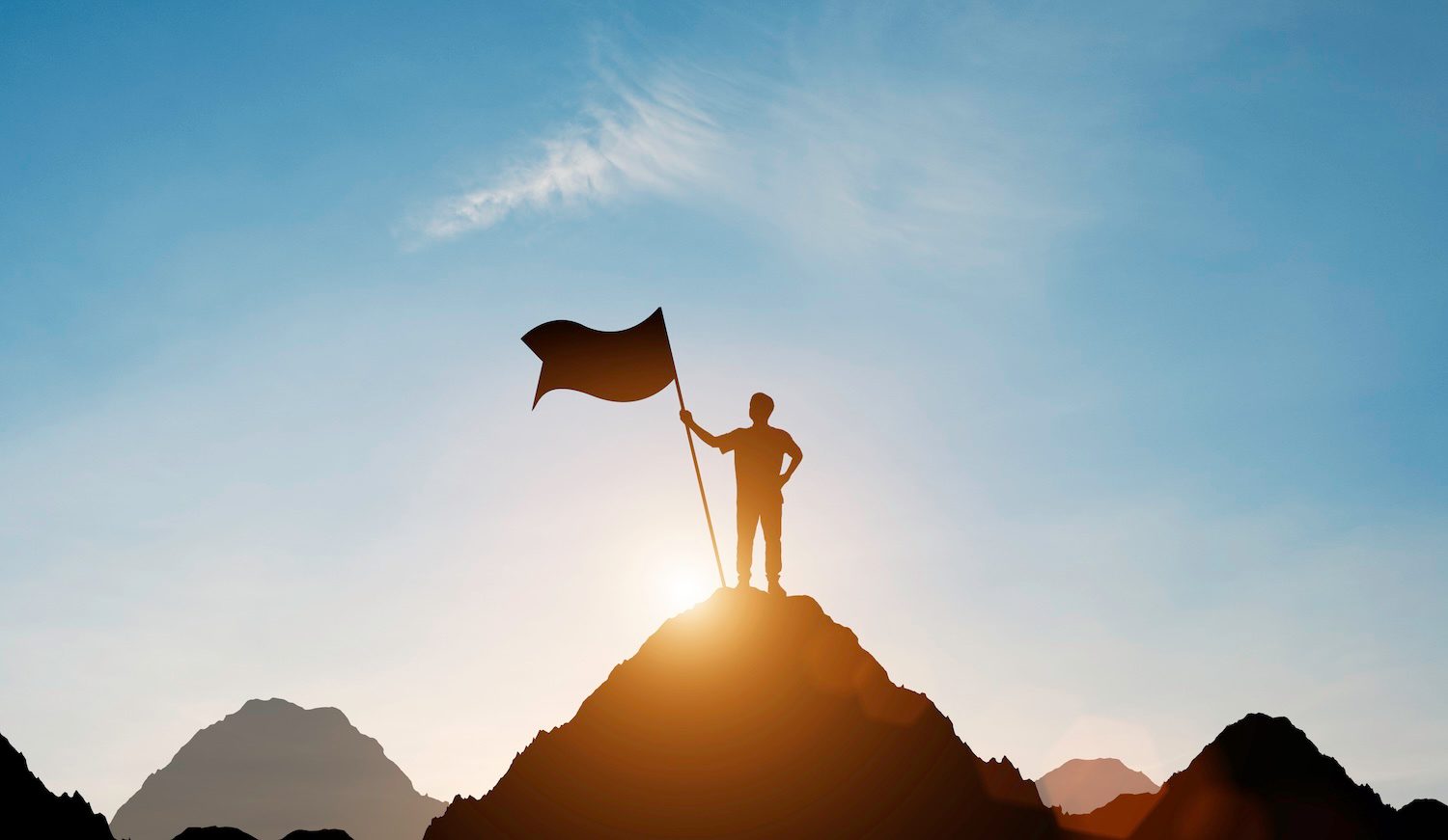 Silhouette businessman holding flag top mountain with blue sky sunlight